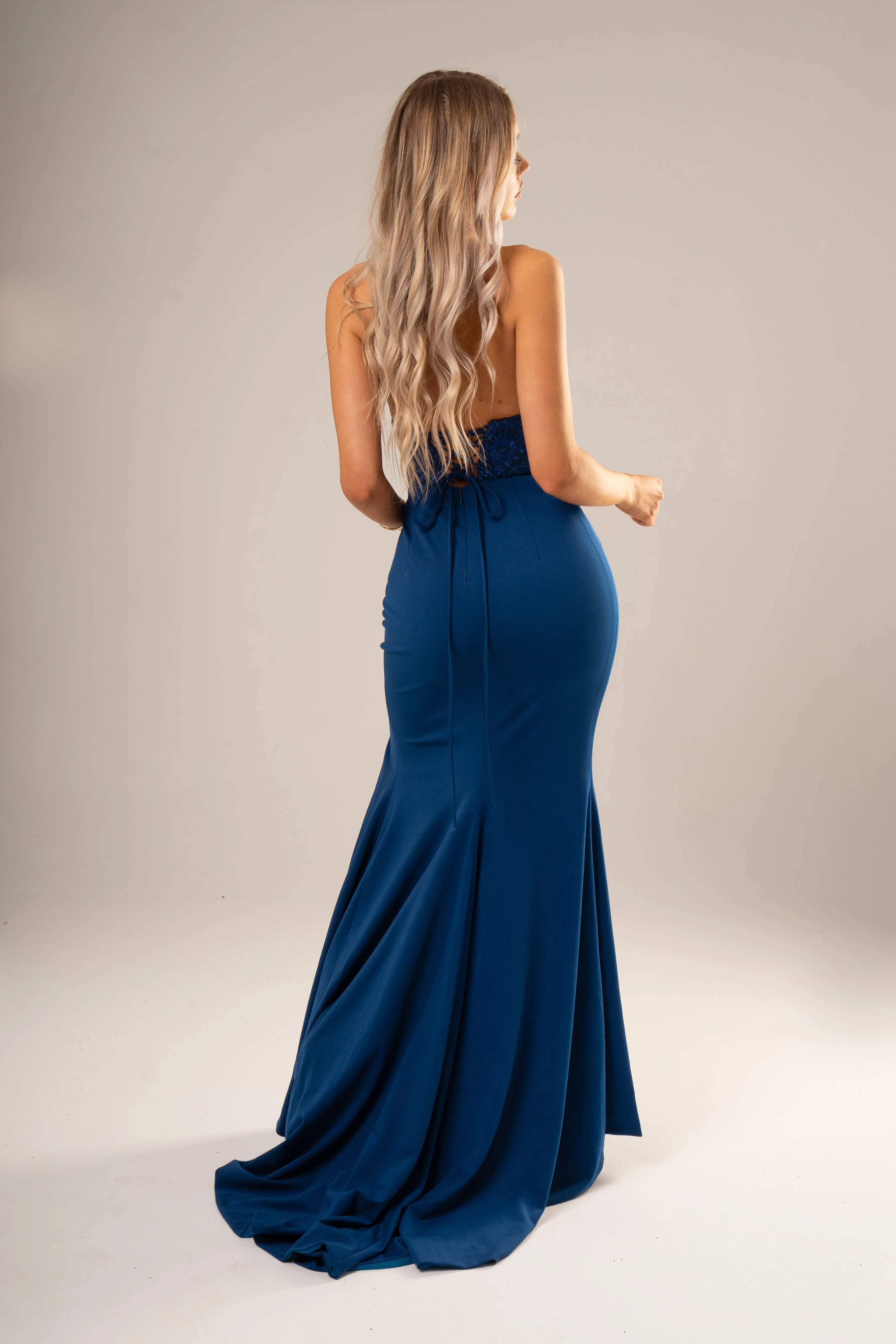 Peacock blue stretch knit mermaid dress for hire
